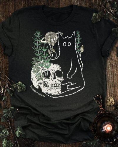 Saturn horsetail cat t-shirt featuring a black cat, a skull with growing horsetail, spring shoots, and Saturn in a hand-drawn botanical illustration.